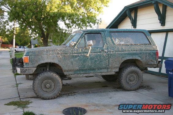 Side view of a muddy 1991 Ford Bronco