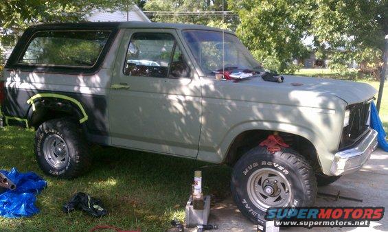 Green 1985 Ford Bronco 3/4 front view, undergoing restoration