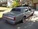 1988 Lincoln Town Car - A gray 1988 Lincoln Town Car is parked in front of a suburban house.