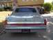 1988 Lincoln Town Car - This 1988 Lincoln Town Car displays its rear end, a chrome bumper and distinctive taillights.