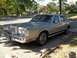 1988 Lincoln Town Car - This 1988 Lincoln Town Car is parked on a concrete pad in front of a house.