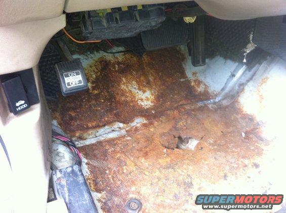 car-arrives-7.jpg The only rust spot on this California poice car; the drivers side floor pan; caused by a water leak from an antenna hole made by the police equipment outfitters.