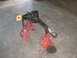 1988 Ford Bronco - A front axle assembly is supported by red jack stands, with a yellow angle finder attached to one end.