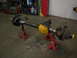 1988 Ford Bronco - Front axle assembly on jack stands, likely for a truck or SUV, in a workshop setting.