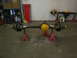 1988 Ford Bronco - Two vehicle axle assemblies are displayed on jack stands in a workshop setting.