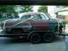 1953 Chevrolet Bel Air - This 1953 Chevrolet Bel Air is seen on a trailer, showing its weathered paint and classic body style.