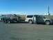 1953 Chevrolet Bel Air - A silver SUV tows a classic car on a trailer down a highway.