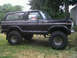 1979 Ford Bronco - Side profile of a modified 1978 Ford Bronco with large off-road tires and a raised suspension.