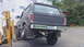1979 Ford Bronco - Black 1978 Ford Bronco rear view, lifted by a forklift. Oregon plate SKY 207.