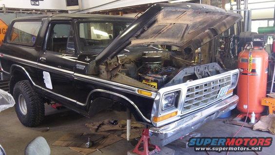 Black 1979 Ford Bronco with hood open, engine visible