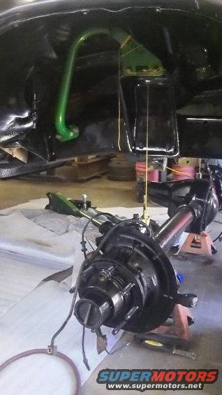 Green suspension arm and black differential assembly