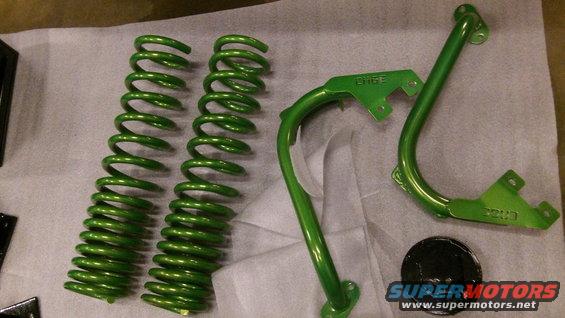 Green painted suspension springs and metal brackets with "EDGE" and "2003" visible