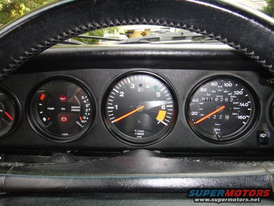 1986 Porsche 911 interior showing tachometer, speedometer, and oil pressure/temp gauges