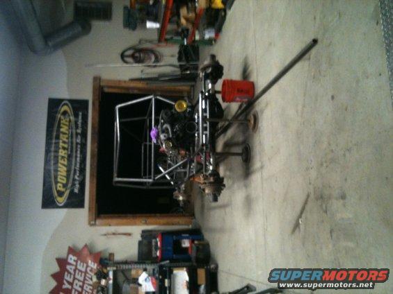 Off-road buggy chassis with engine and suspension components visible