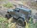 1979 Ford Bronco - An off-road vehicle navigates a muddy, leaf-strewn path during an outdoor excursion.