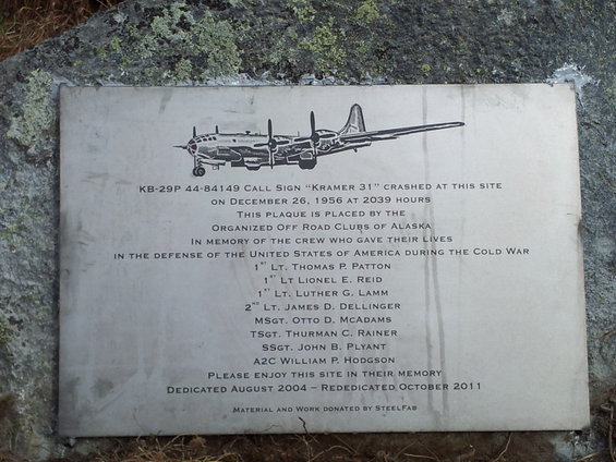 Plaque shows a B-29 bomber, lists crew names, and states it crashed on Dec 26, 1956