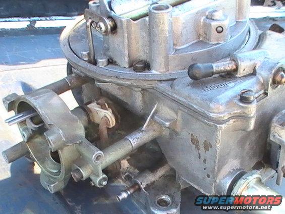 Close-up of a Holley carburetor with visible linkages and fuel lines