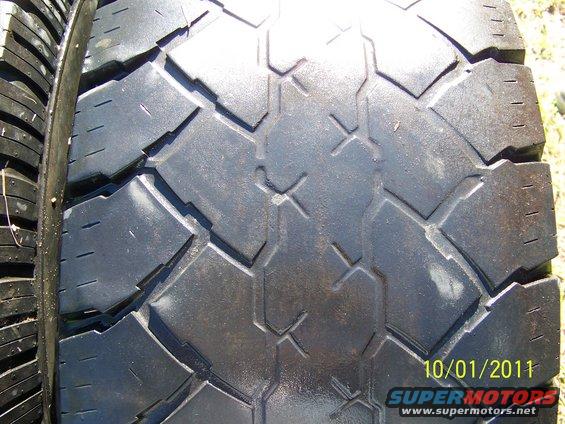 Close-up of a tire tread pattern with a date stamp