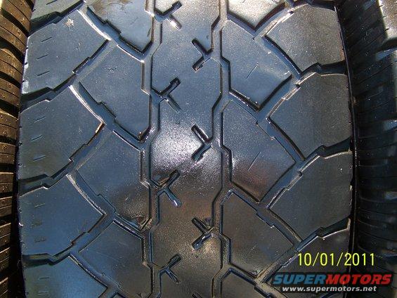 Close-up of a tire tread pattern with a date stamp