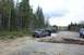 1995 Ford F-250 - A Ford F-250 tows a Ford Bronco on a rough dirt road with trees in the background.