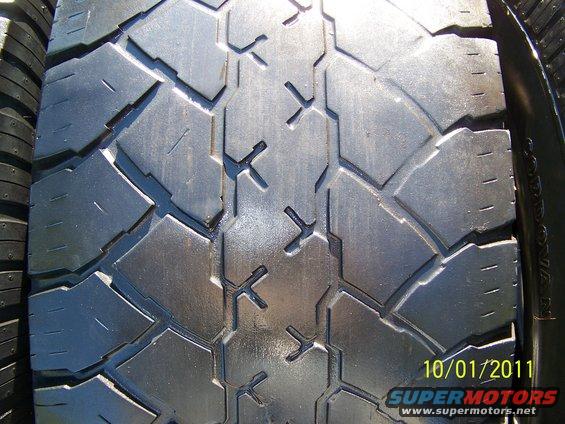 Close-up of a tire tread pattern. Date stamp reads 10/01/2011