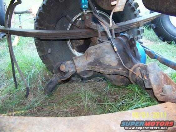 Rear axle and leaf spring assembly with blue shock absorber