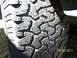 35x12.50x15 BFG All Terrains 40-50% tread.  2 showing alingment wear.  On aluminum bullet holes, 5 o...