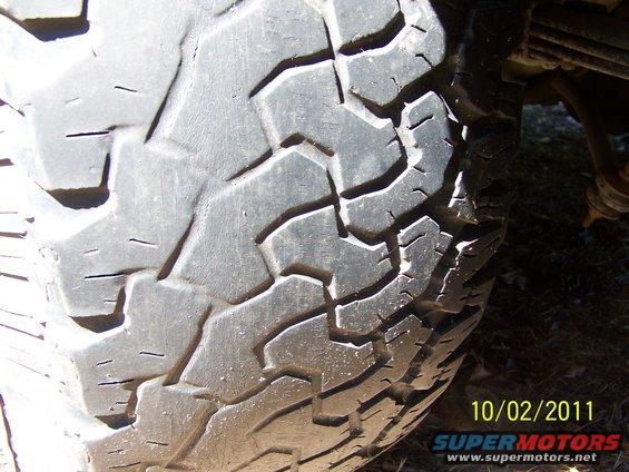 35x12.50x15 BFG All Terrains 40-50% tread.  2 showing alingment wear.  On aluminum bullet holes, 5 on 5.5.