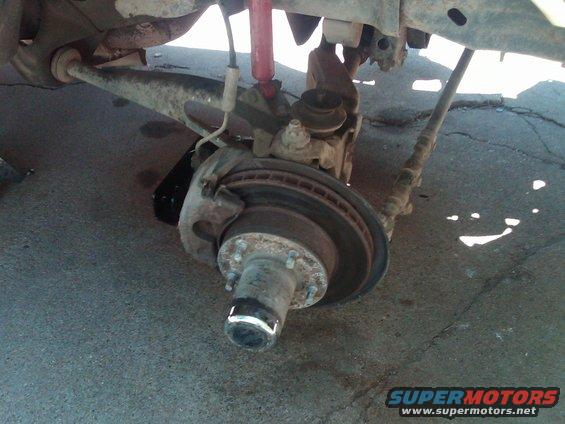 Front suspension part with brake rotor and hub