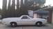 1978 Ford Ranchero - A white 1978 Ford Ranchero is parked in front of a house and garage.