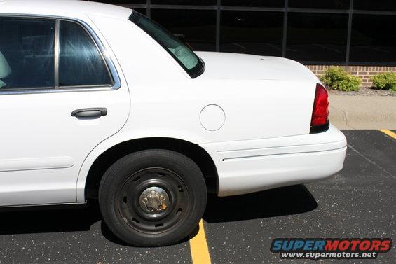 White 2003 Ford Crown Victoria sedan, rear quarter panel and side view
