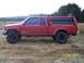 1991 Toyota Pickup/SR5 - This 1991 Toyota Pickup SR5 is equipped with a camper shell and roof rack, seen here in a side profile.