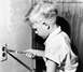 1978 Ford F-250 - A child is shown inserting a knife into an electrical outlet, a dangerous act.