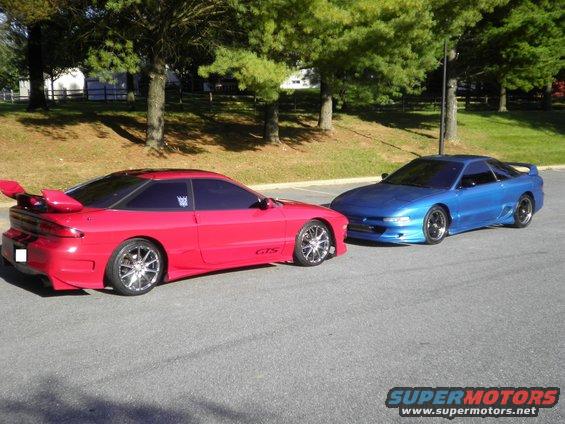 red and blue Ford Probes parked next to each other