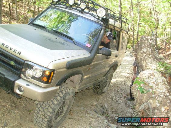 58shaffhol.jpg Shaffner's Hollow (2nd run)

Shortly after this pic, the panhard bar pulled apart.  Apparently, the guy who "lengthened" it simply unscrewed it to the point that only ~2 threads were engaged, and Clay didn't check when he installed it.  It took us some time to chase the threads enough to get it back together.  Then we crossed some straps to try to reduce the load on the bar as we drove out.  One of the straps dropped out, but the bar held back to the parking lot & onto the trailer.