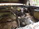 1985 Ford Bronco - View of the engine bay, showing the brake booster, master cylinder, and various wiring harnesses.