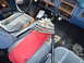 1985 Ford Bronco - Interior view of a 1985 Ford Bronco, blue seats, dashboard, and floor details.