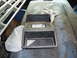 1985 Ford Bronco - Center console trim piece with openings for radio and storage, possibly from an older vehicle.