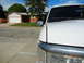 1996 Ford Bronco - White Ford truck parked in a suburban driveway on a sunny day.