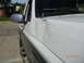 1996 Ford Bronco - The vehicle has visible damage to the front fender and door, with scratches across the body panels.