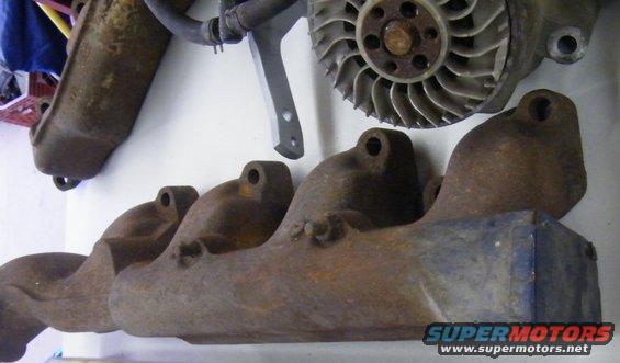rusty exhaust manifold and a fan shroud