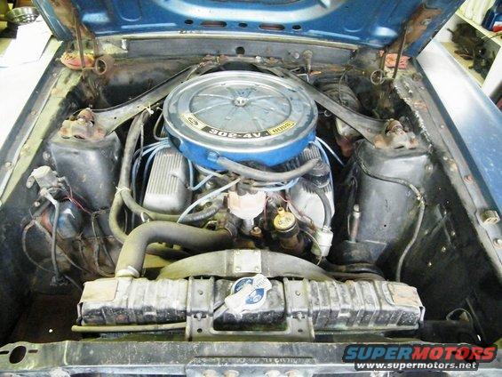Blue Ford Mustang engine bay with a 302-4V air cleaner and radiator