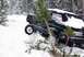 1996 Ford Bronco - A 1996 Ford Bronco is being pulled from a snowy embankment in a wooded area.