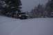 1996 Ford Bronco - A 1996 Ford Bronco navigates a snow-covered path through a wooded area.