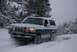 1996 Ford Bronco - This two-tone Ford Bronco navigates a snowy trail, equipped with a front brush guard.
