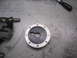 1974 Ford Bronco - A fuel filler cap is shown on a workbench with a glove and tool nearby.