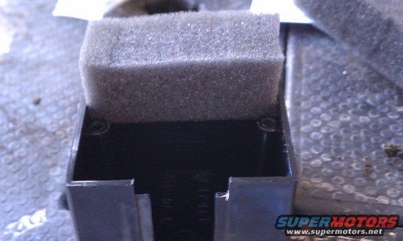 Black plastic part with foam insert, Supermotors.net logo