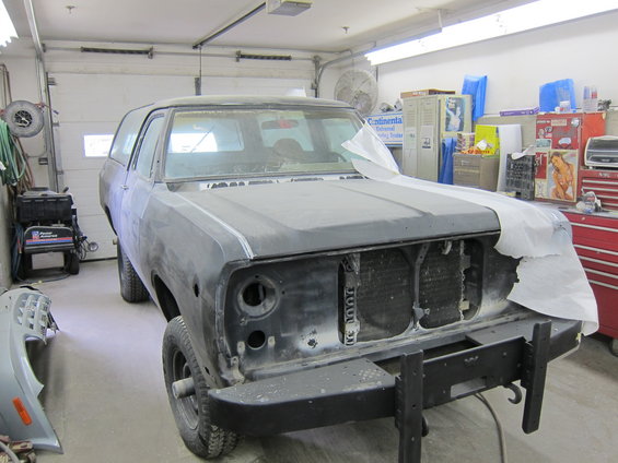 1987 Dodge 1500 front view in garage, primer finish