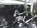 1996 Ford Bronco - The interior floor of a vehicle has been coated with a black protective material.