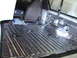 1996 Ford Bronco - The interior of a vehicle is being prepared for soundproofing, with insulation covering the floor and lower panels.